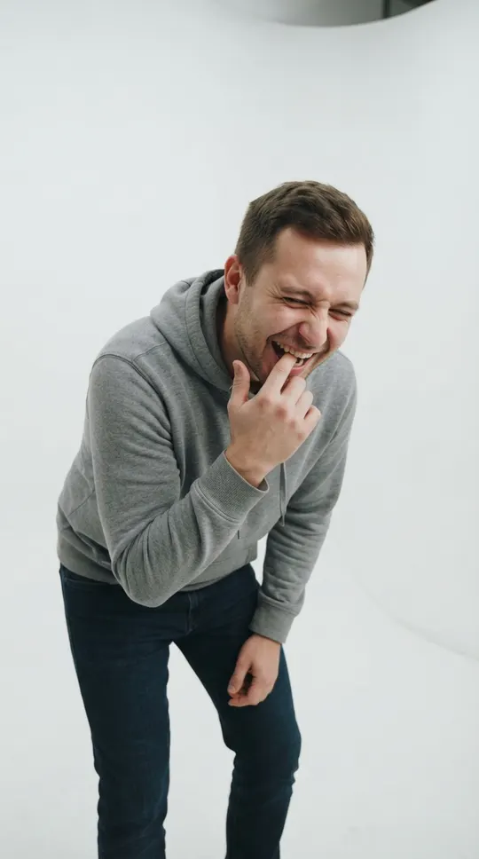 Oh you can make it cap AI video example made from one photo: a man giggling and biting his finger