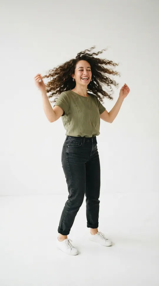 Oh you can make it cap AI video example: a woman with curly hair spinning and flipping her hair